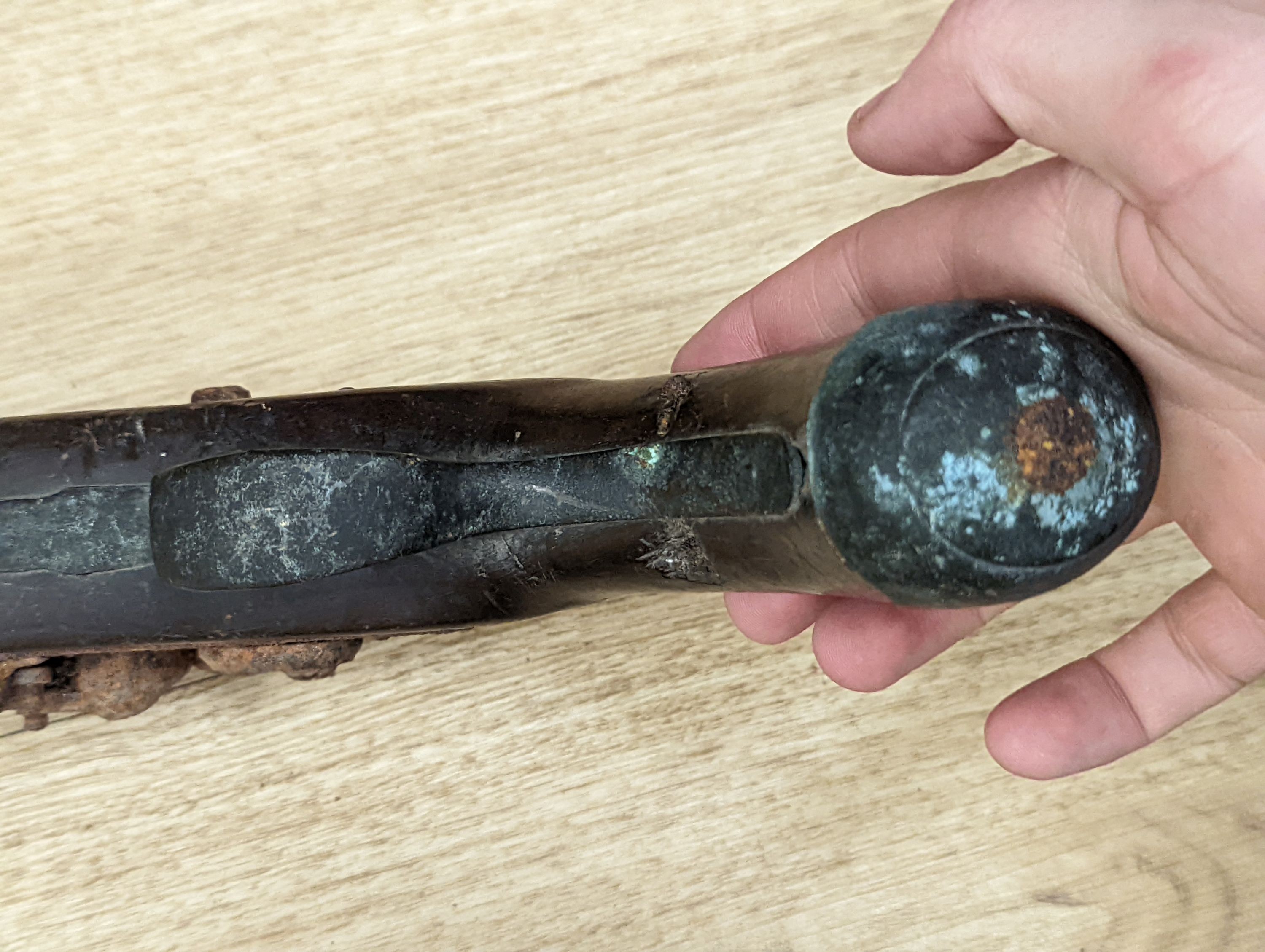 Two 19th century flintlock pistols and a pocket pistol, largest 40 cms long.